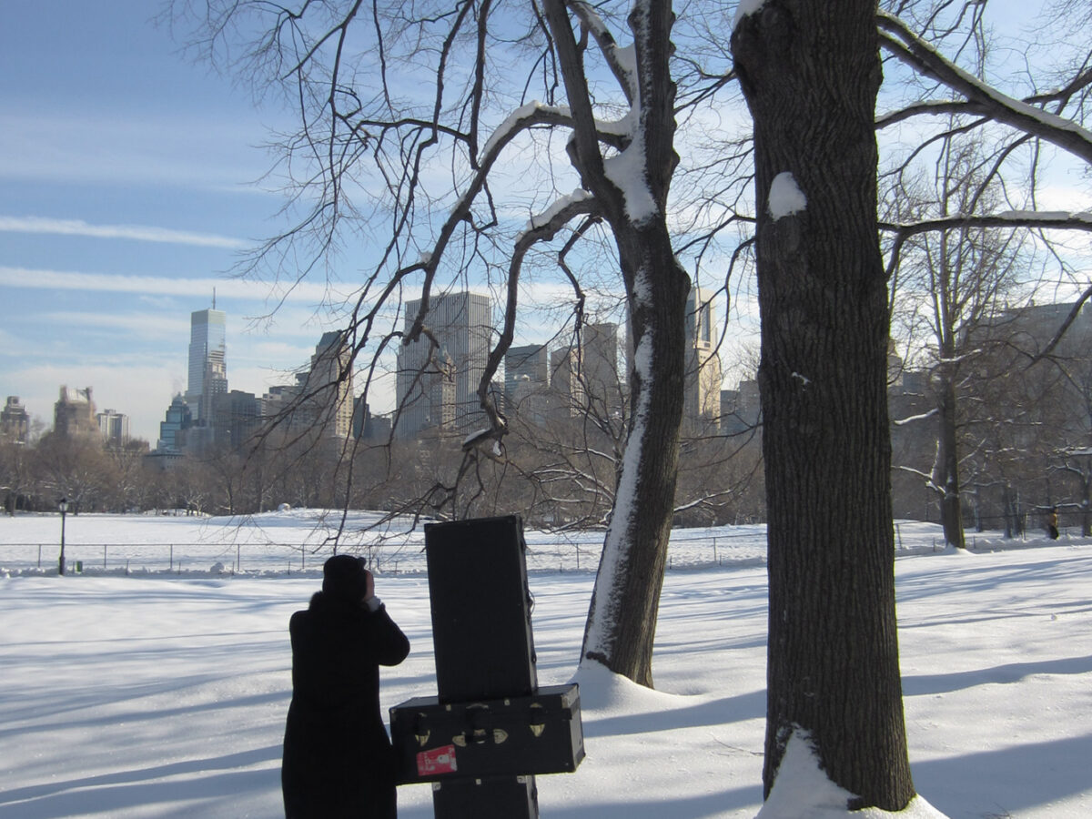Vera photographing in the snow in Central Park